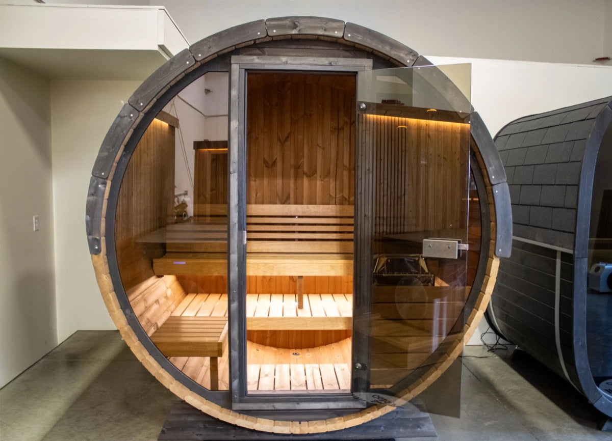 Barrel sauna lit from within on the NW Immersion showroom floor