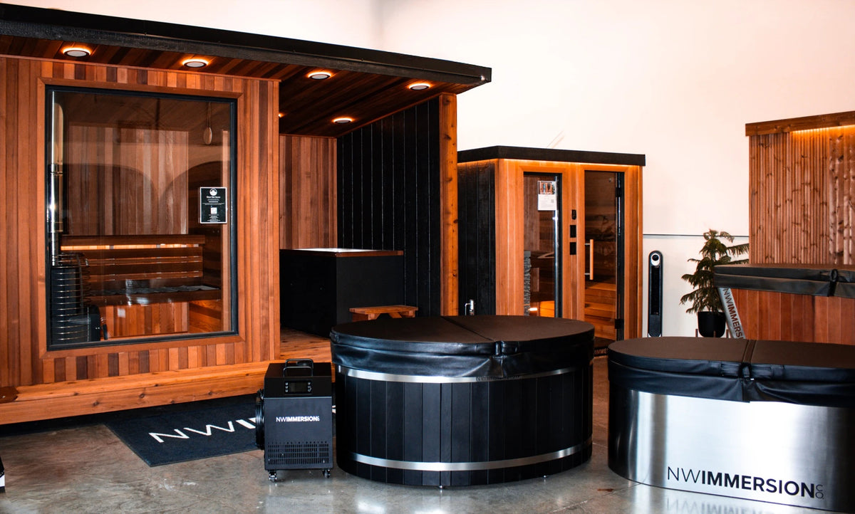 Wide view of the NW Immersion showroom floor with saunas and cold plunges on display