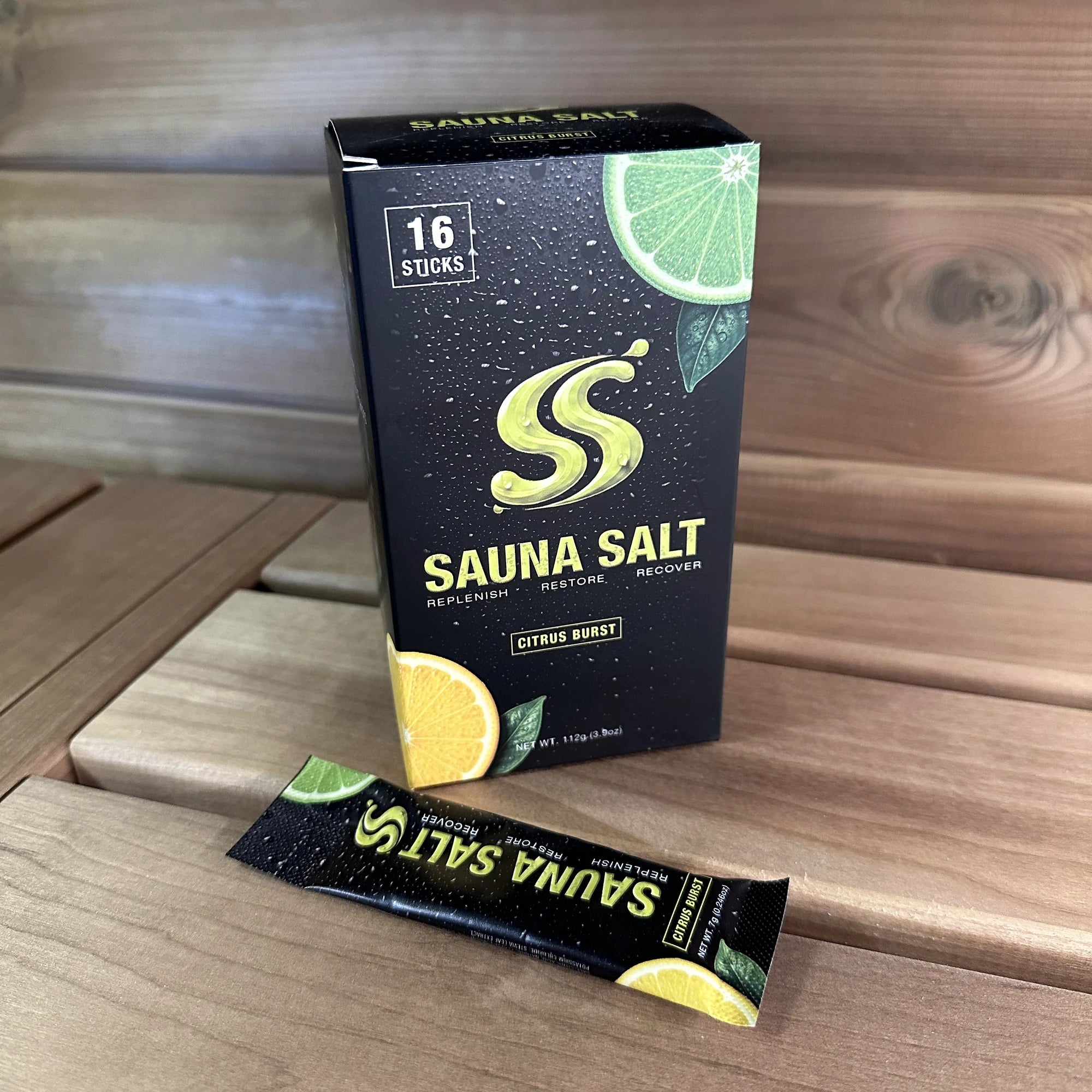 Sauna Salt Citrus Burst box and individual stick on a sauna bench